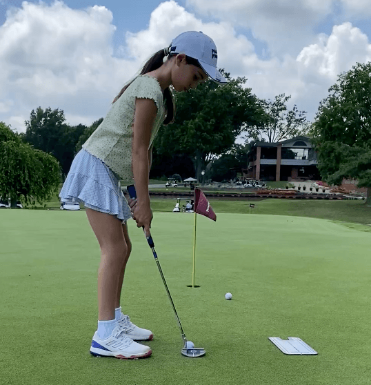 Golfer lining up a putt